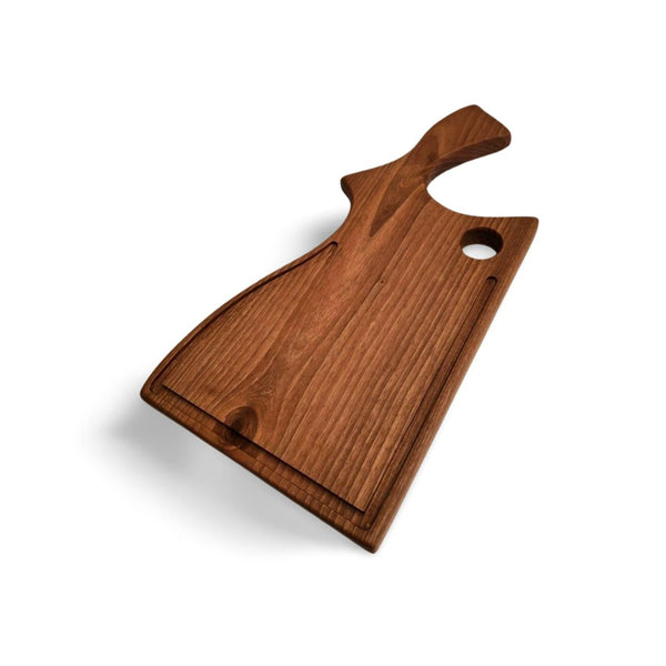 Skærebræt i massiv valnød med håndtag fra Træverden. Funktionelt og elegant design.